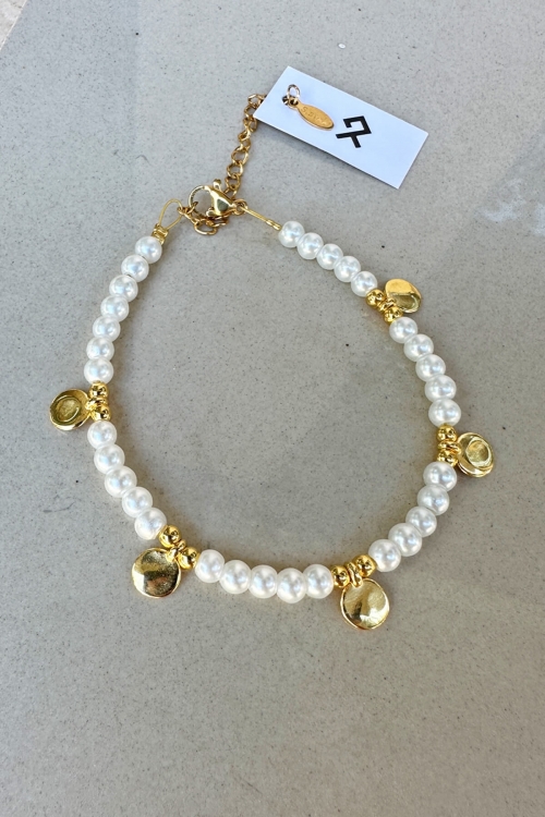 Bracelet with white beads & tassels